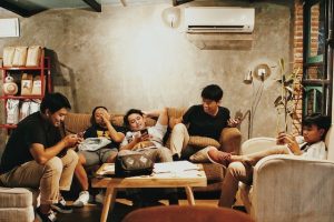 Group of kids sitting on a sofa.